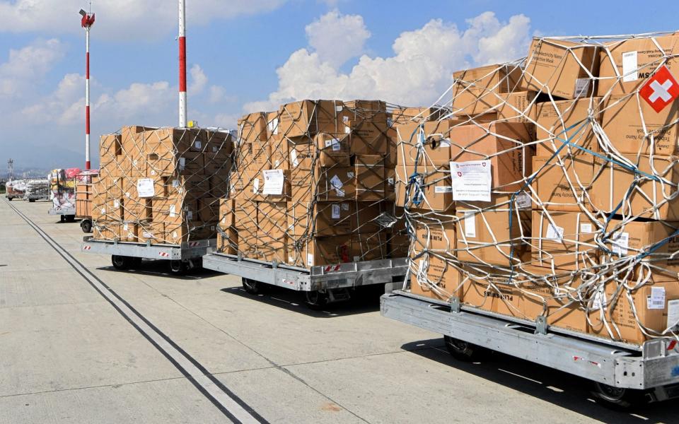 Stacked essential medical equipment supplies from Switzerland to Nepal - AFP