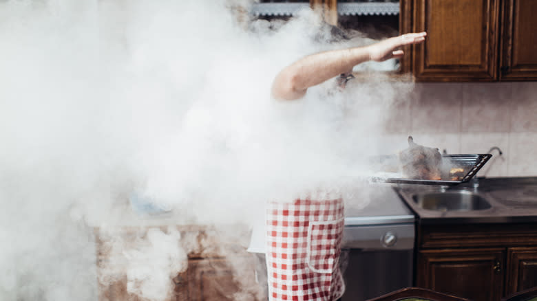 Man with burning chicken