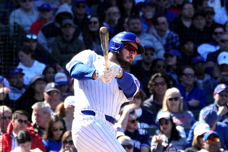 Chicago Cubs' Mike Tauchman swings through his pinch-hit, RBI single off Miami Marlins relief pitcher Declan Cronin during the fifth inning of a baseball game Friday, April 19, 2024, in Chicago. (AP Photo/Charles Rex Arbogast)