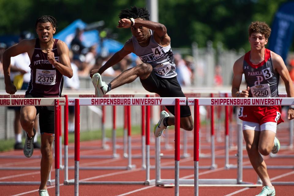 South Western's Bernard Bell (center) competes to a silver medal in the 3A 110-meter hurdles at the PIAA Track and Field Championships at Shippensburg University Saturday, May 27, 2023.
