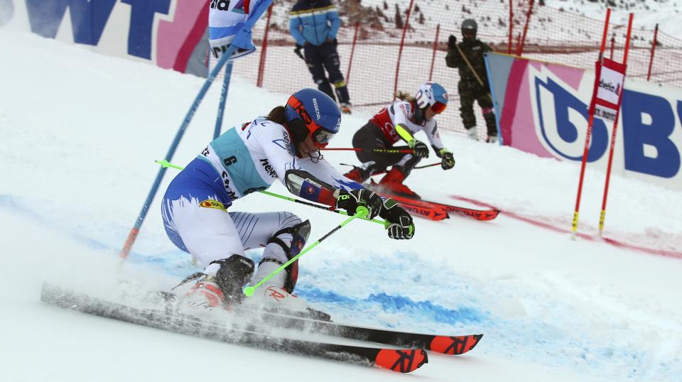 Slovakia's Petra Vlhova, foreground, and United States' Mikaela Shiffrin compete in a women's World Cup parallel slalom, in St. Moritz, Switzerland, Sunday, Dec. 9, 2018. (AP Photo/Marco Trovati)