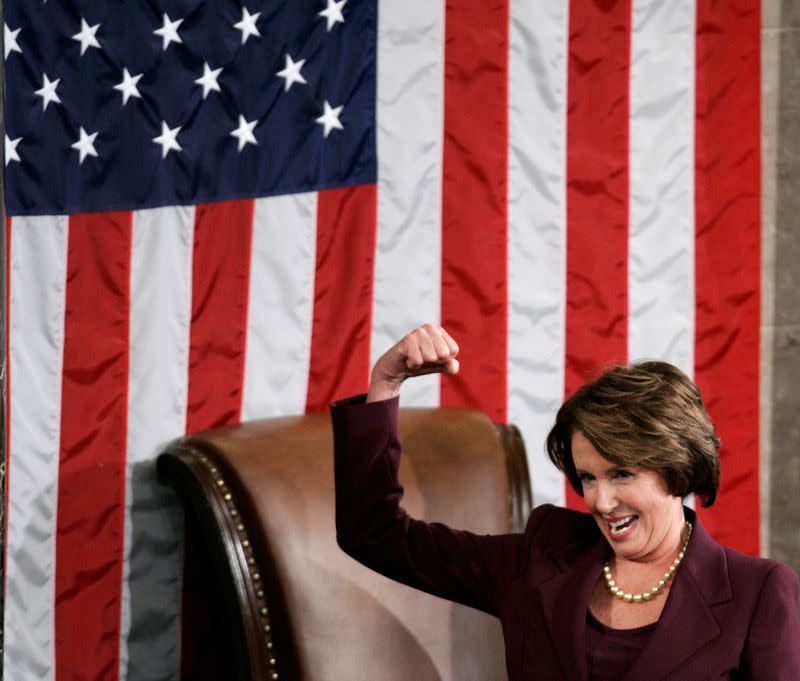 FILE PHOTO: U.S. Speaker of the House Nancy Pelosi (D-Ca) reacts as she takes the podium for the first time after being elected the first ever female Speaker of the U.S. House of Representatives on the first day of the 110th Congress in Washington