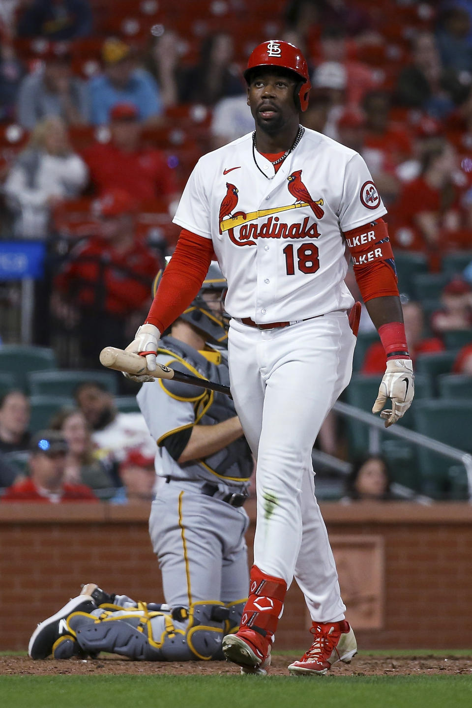 St. Louis Cardinals' Jordan Walker walks back to the dugout after striking out during the ninth inning of the team's baseball game against the Pittsburgh Pirates on Thursday, April 13, 2023, in St. Louis. (AP Photo/Scott Kane)