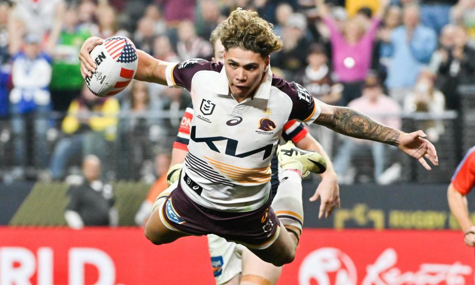 <span>Broncos star Reece Walsh scores a spectacular try during the match against the Sydney Roosters as NRL invades the USA at Allegiant Stadium in Las Vegas.</span><span>Photograph: David Becker/AP</span>