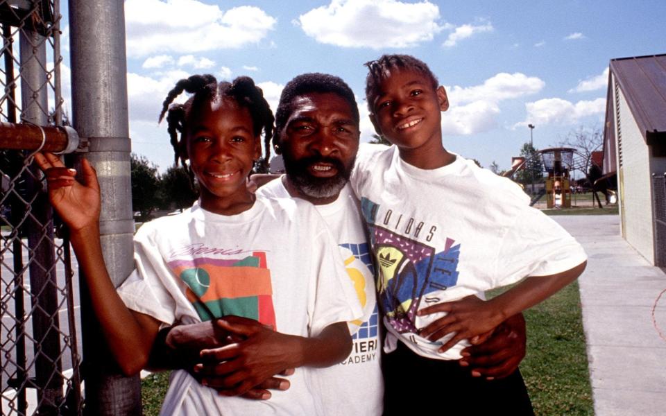 Venus and Serena Williams with their father, Richard, in 1991