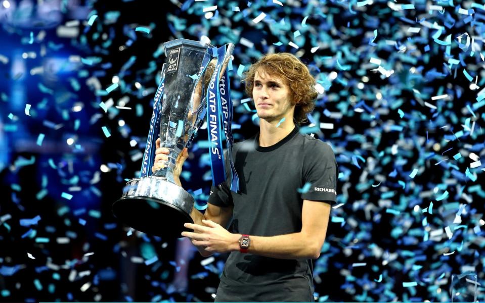 Alexander Zverev holds the ATP Finals trophy after winning the biggest title of his career - Getty Images Europe