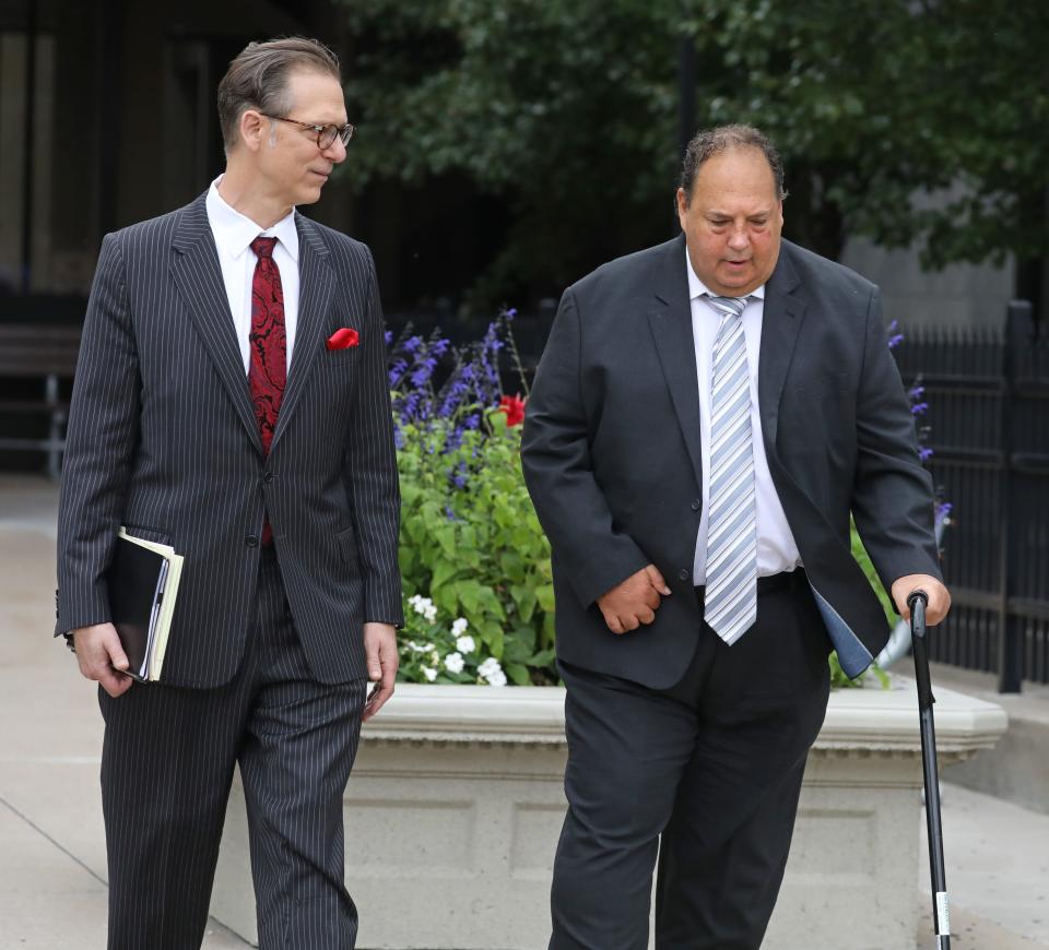 Steven Rosenbaum, right, leaves the Federal Courthouse with his attorney Peter Pullano, Wednesday, Aug. 23, 2023 in downtown Rochester.