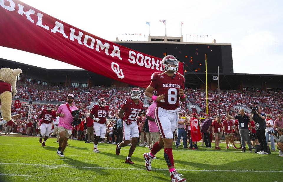 Oklahoma Sooners quarterback Dillon Gabriel runs onto the field before the game against the UCF Knights at Gaylord Family-Oklahoma Memorial Stadium.