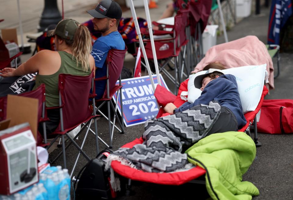 Supporters of U.S. President Donald Trump sleep outside the BOK Center in the early morning Friday while lined up to attend the Trump campaign rally near the BOK Center on June 19, 2020 in Tulsa, Oklahoma.