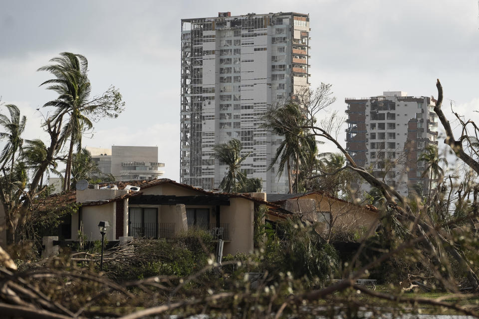 Buildings are surrounded by debris in the aftermath of Hurricane Otis in Acapulco, Mexico, Friday, Oct. 27, 2023. (AP Photo/Felix Marquez)