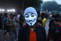 NEW DELHI, INDIA - DECEMBER 19: A demonstrator in an anonymous facemask against the Citizenship Amendment Act (CAA) and National Register of Citizens (NRC) at Jantar Mantar on December 19, 2019 in New Delhi, India. The act seeks to grant Indian citizenship to refugees from Hindu, Christian, Sikh, Buddhist and Parsi communities fleeing religious persecution from Pakistan, Afghanistan, and Bangladesh, and who entered India on or before December 31, 2014. The Parliament had passed the Citizenship (Amendment) Bill, 2019 last week and it became an act after receiving assent from President Ram Nath Kovind. Since then, protests including some violent ones have erupted in various regions of the country, including the North East over the amended citizenship law.(Photo by Sanchit Khanna/Hindustan Times via Getty Images)