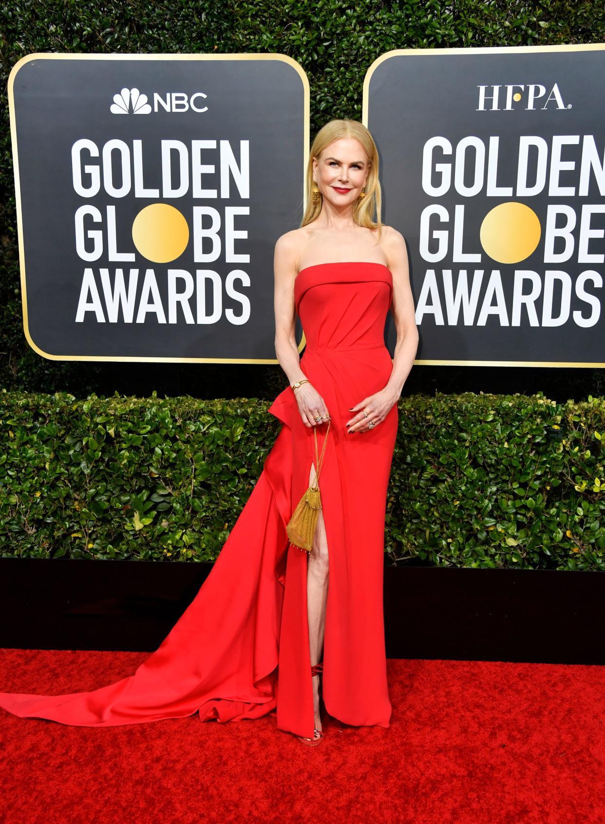 Nicole Kidman looks dazzling in red floor-sweeping dress with matching heel sandals on the red carpet.