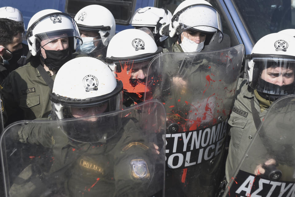 Police clash with protesters at the University of Thessaloniki in northern Greece, on Monday, Feb. 22, 2021. Police clashed with protesters and detained more than 30 people in Greece's second-largest city Monday during a demonstration against a new campus security law. (AP Photo/Giannis Papanikos)