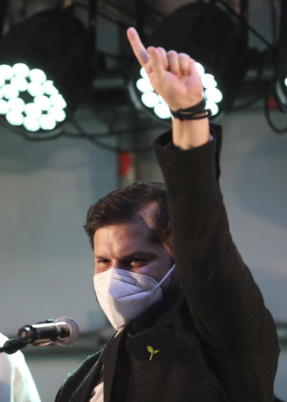 Presidential candidate Gabriel Boric, of the political alliance "Apruebo Dignidad," or I Approve of Dignity, gestures before supporters at his election day headquarters after polls closed and partial results were announced in Santiago, Chile, Sunday, Nov. 21, 2021. (AP Photo/Aliosha Marquez)