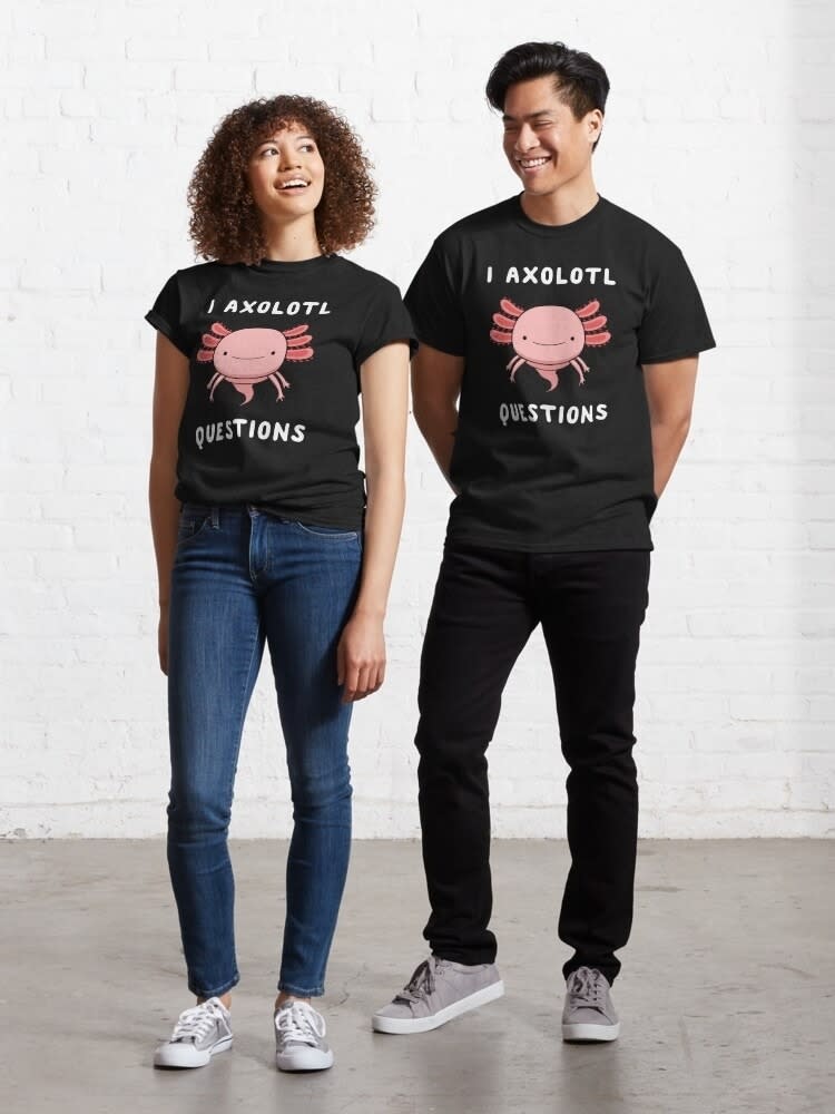 Two people wearing matching black T-shirts with "I AXOLOTL QUESTIONS" print and axolotl graphic, posing casually