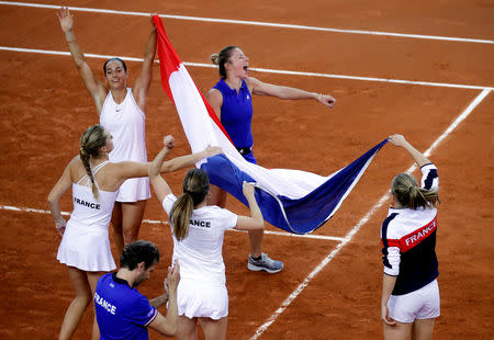 Tennis - Fed Cup - World Group Semi-Final - France v Romania - Kindarena, Rouen, France - April 21, 2019 France celebrate victory in the semi-final REUTERS/Charles Platiau