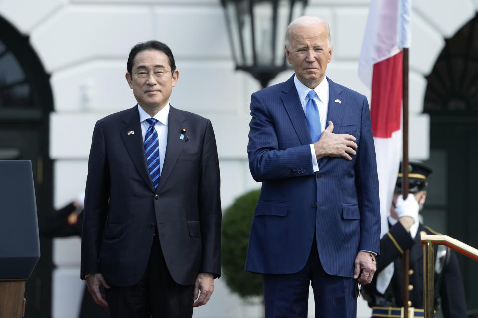 President Joe Biden, right, and Japanese Prime Minister Fumio Kishida stand as the U.S. national anthem plays during a State Arrival Ceremony on the South Lawn of the White House, Wednesday, April 10, 2024, in Washington. (AP Photo/Susan Walsh)