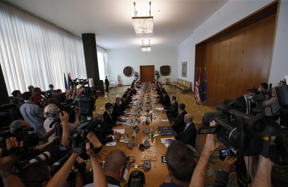 US President Donald Trump's envoy for Serbia-Kosovo talks Richard Grenell speaks with Serbian President Aleksandar Vucic at the Serbia Palace in Belgrade, Serbia, Tuesday, Sept. 22, 2020. Trump's administration has been working to normalize relations between Serbia and Kosovo, two former Balkan war foes, and two weeks ago Serbian President Aleksander Vucic and Kosovo Prime Minister Avdullah Hoti signed an economic normalization deal at the White House. (AP Photo/Darko Vojinovic)