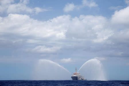 The Migrant Offshore Aid Station (MOAS) ship Topaz Responder tests its fire hoses during a crew training exercise as the ship stands by for migrants in distress in international waters off the coast of Libya, June 22, 2016. REUTERS/Darrin Zammit Lupi