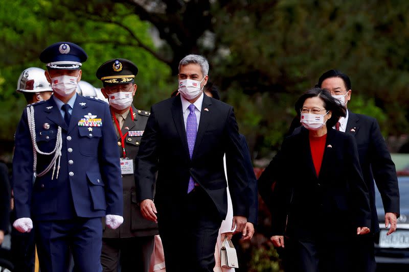 Taiwan President Tsai Ing-wen and visiting Paraguay President Mario Abdo Benitez arrive at the welcome ceremony in Taipei