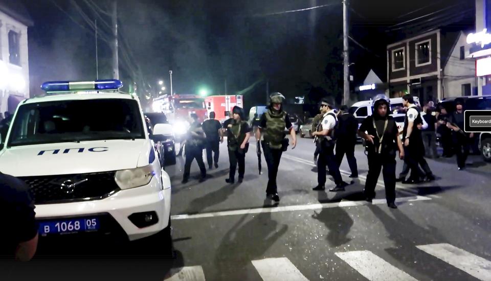 In this photo taken from video released by the National Antiterrorism Committee on Monday, June 24, 2024, Police conduct a counter-terrorist operation in the Republic of Dagestan, Russia. Multiple police officers and several civilians, including an Orthodox priest, were killed by armed militants in Russia’s southern republic of Dagestan on Sunday, its governor Sergei Melikov said in a video statement early Monday. (The National Antiterrorism Committee via AP)