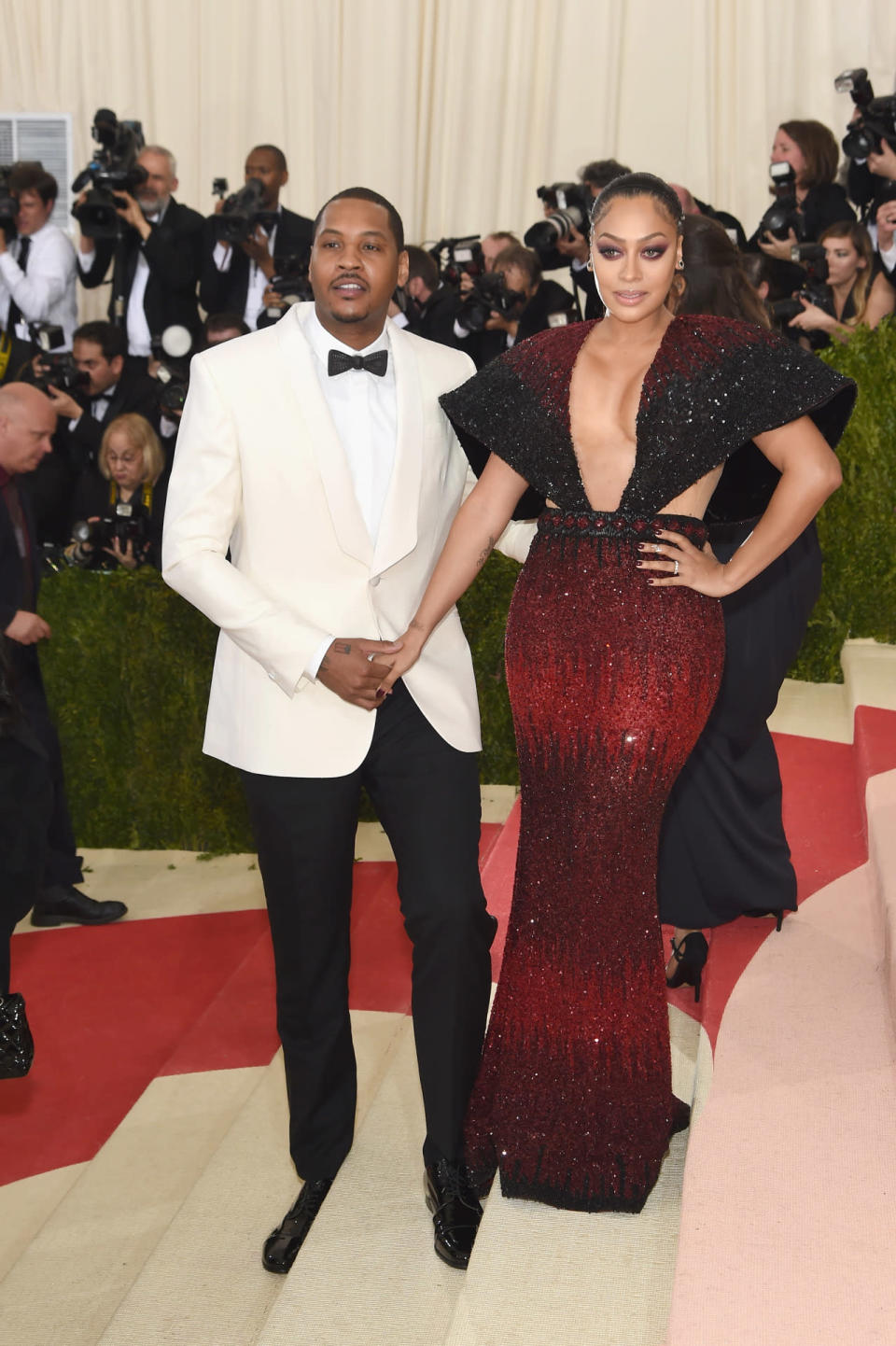 Carmelo Anthony in Public School with his wife Lala Anthony in a red and black sequin dress 