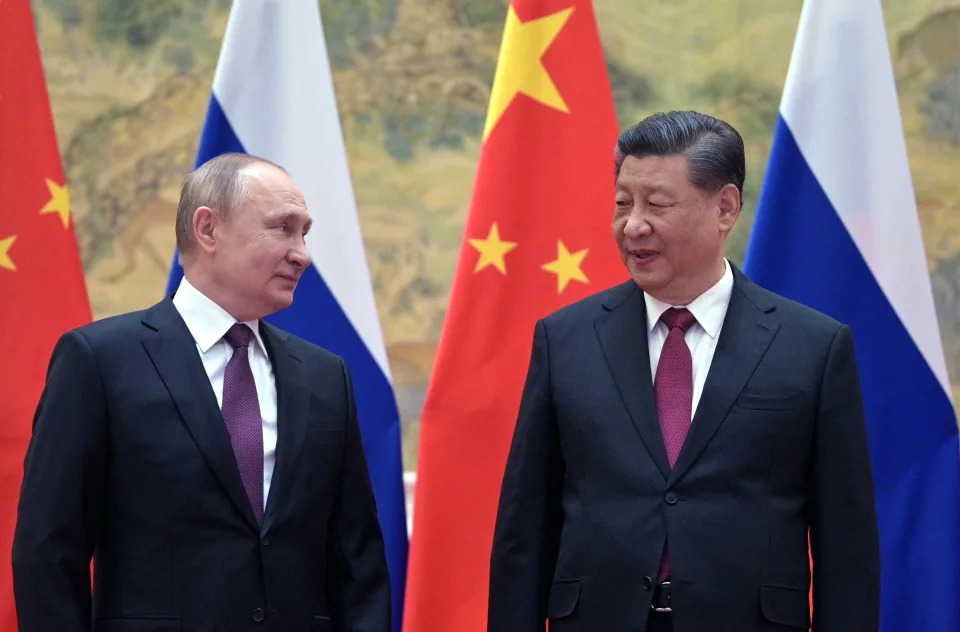 TOPSHOT - Russian President Vladimir Putin (L) and Chinese President Xi Jinping pose for a photograph during their meeting in Beijing, on February 4, 2022. (Photo by Alexei Druzhinin / Sputnik / AFP) (Photo by ALEXEI DRUZHININ/Sputnik/AFP via Getty Images)