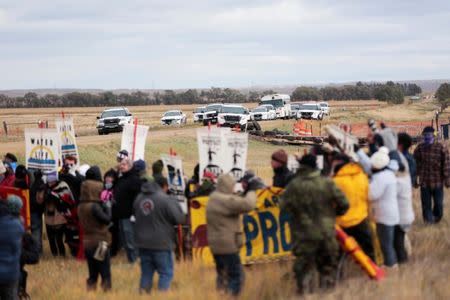 Dakota Access Pipeline protesters square off against police between near Standing Rock Reservation and the pipeline route outside the little town of Saint Anthony, North Dakota, U.S., October 5, 2016. REUTERS/Terray Sylvester