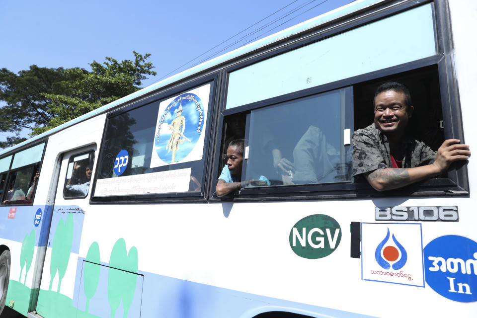 Released prisoners on a bus smile as they meet their family members and colleagues from a bus outside Insein Prison in Yangon, Myanmar, Thursday, Jan. 4, 2024. Myanmar’s military government on Thursday pardoned nearly 10,000 prisoners to mark the 76th anniversary of gaining independence from Britain, but it wasn’t immediately clear if any of those released included the thousands of political detainees jailed for opposing army rule. (AP Photo/Thein Zaw)