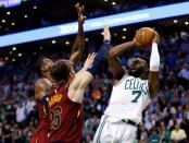 May 15, 2018; Boston, MA, USA; Boston Celtics guard Jaylen Brown (7) attempts a shot against Cleveland Cavaliers forward LeBron James (23) and guard Kyle Korver (26) during the fourth quarter of game two of the Eastern conference finals of the 2018 NBA Playoffs at TD Garden. Mandatory Credit: Greg M. Cooper-USA TODAY Sports