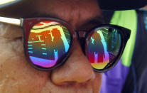 <p>A slogan reading “Right” is reflected to sunglasses during a Labor Day rally in Taipei, Taiwan, May 1, 2018. Thousands of protesters from various labor groups marked Labor Day, or May Day as it is observed elsewhere in the world with demands for better conditions for workers. (Photo: Chiang Ying-ying/AP) </p>