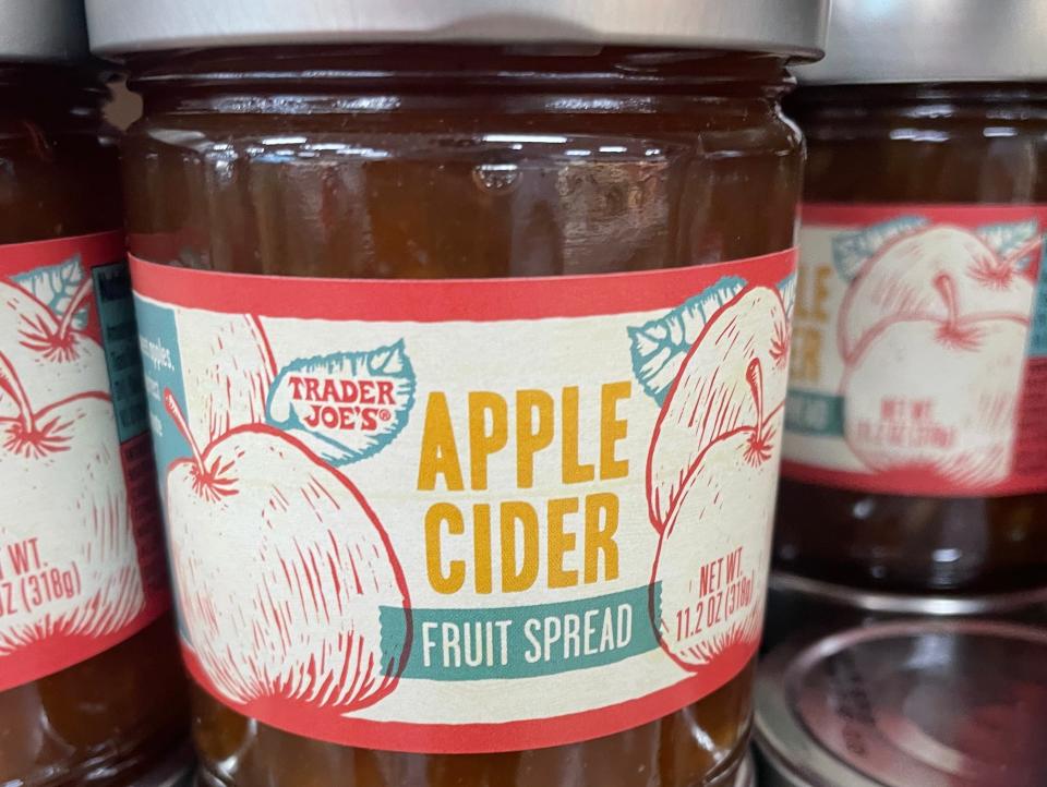 jars of apple-cider jam on the shelves at trader joes