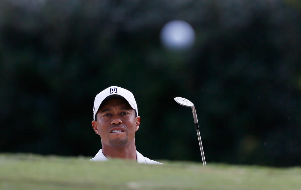 ATLANTA, GA - SEPTEMBER 20: Tiger Woods watches his bunker shot on the ninth hole during the first round of the TOUR Championship by Coca-Cola at East Lake Golf Club on September 20, 2012 in Atlanta, Georgia. (Photo by Kevin C. Cox/Getty Images)