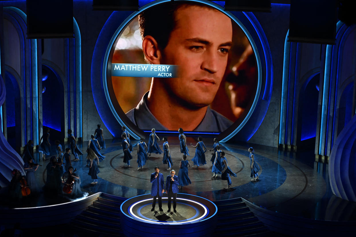 TOPSHOT - Late US-Canadian actor Matthew Perry is shown on screen as Italian tenor Andrea Bocelli and his son Italian singer Matteo Bocelli perform during an in memoriam segment onstage during the 96th Annual Academy Awards at the Dolby Theatre in Hollywood, California on March 10, 2024. (Photo by Patrick T. Fallon / AFP) (Photo by PATRICK T. FALLON/AFP via Getty Images)