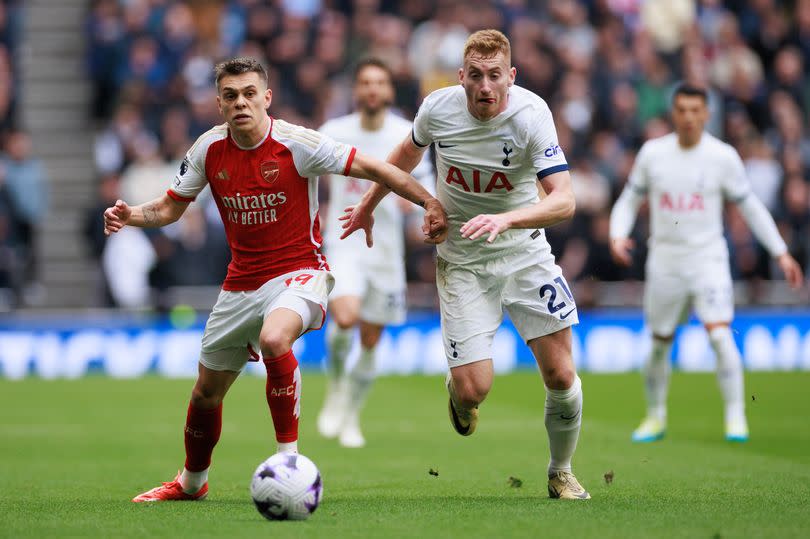 Leandro Trossard and Dejan Kulusevski in action during the North London Derby between Tottenham and Arsenal