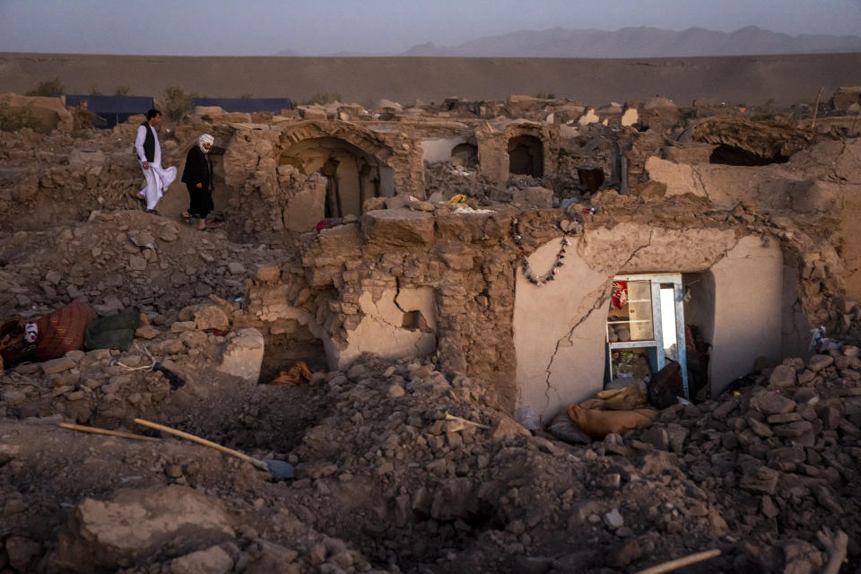 Afghan men search for victims after an earthquake in Zenda Jan district in Herat province, of western Afghanistan, Sunday, Oct. 8, 2023. Powerful earthquakes killed at least 2,000 people in western Afghanistan, a Taliban government spokesman said Sunday. It's one of the deadliest earthquakes to strike the country in two decades. (AP Photo/Ebrahim Noroozi)