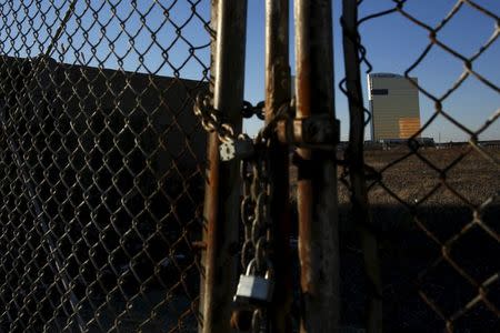 The Water Club, a hotel connected to the Borgata Hotel Casino and Spa, is seen through a locked fence in Atlantic City, New Jersey, January 19, 2016. REUTERS/Shannon Stapleton