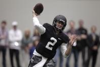 Texas A&M quarterback Johnny Manziel passes the ball during a drill at pro day for NFL football representatives in College Station, Texas, Thursday, March 27, 2014. (AP Photo/Patric Schneider)