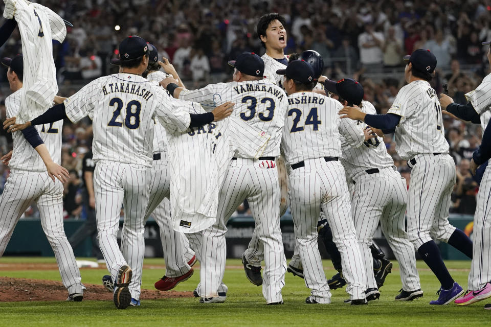 Japan pitcher Shohei Ohtani (16) celebrates after defeating the U.S. at the World Baseball Classic final game, Tuesday, March 21, 2023, in Miami. (AP Photo/Marta Lavandier)