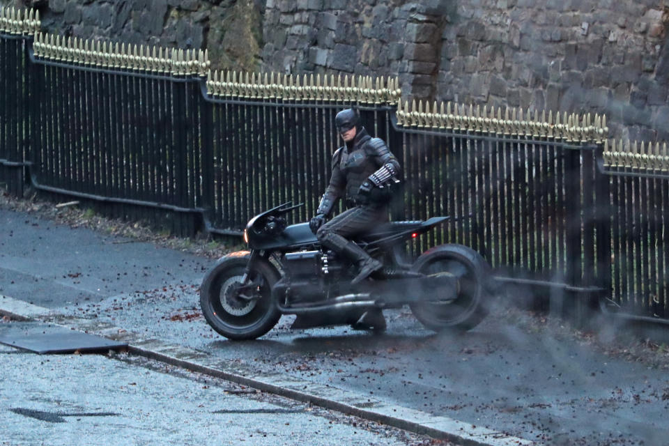 A man dressed as Batman sits on a motorcycle as filming continues in Glasgow for a new movie for the Batman superhero franchise. (Photo by Andrew Milligan/PA Images via Getty Images)