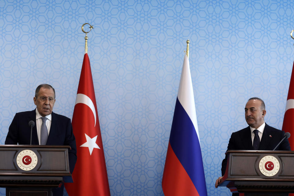 Turkish Foreign Minister Mevlut Cavusoglu, right, and his Russian counterpart Sergey Lavrov speak to the media after their talks, in Ankara, Turkey, Friday, April 7, 2023. Lavrov and Cavusoglu have discussed regional issues and bilateral relations.(AP Photo/Burhan Ozbilici)