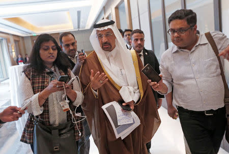 Saudi Arabia's Energy Minister Khalid al-Falih (C) talks to the media as he leaves after a meeting in New Delhi, India, February 23, 2018. REUTERS/Adnan Abidi