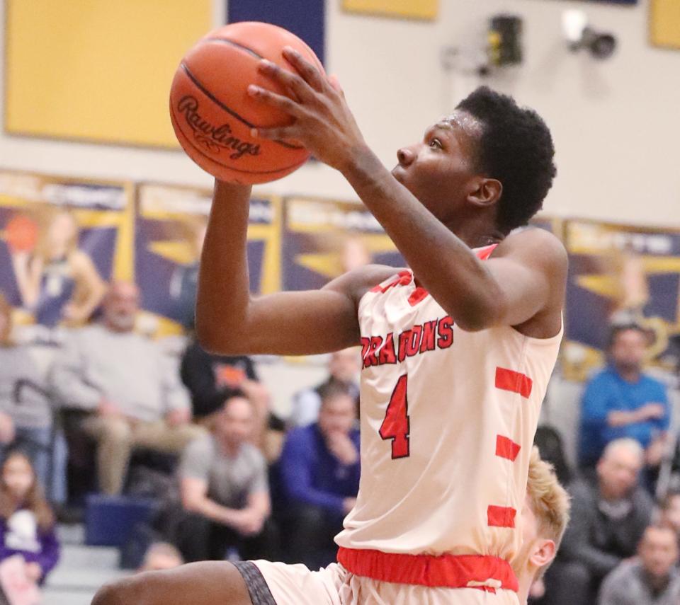 East's La'Grand Sowell goes for a layup against Revere during the Div. II district semifinal boys basketball game at North Ridgeville Academic Center on Thursday.