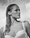 <p> Ursula Andress was a relatively unknown actor in the early 1960s. But when she emerged from the ocean in a white bikini, wielding a knife and poring over some shells as Honey Ryder in <em>Dr. No</em>, she became instantly iconic (and what followed was a slew of movies in this decade and beyond). </p>