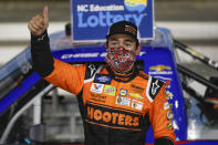 Chase Elliott celebrates after winning the NASCAR Truck Series auto race at Charlotte Motor Speedway Tuesday, May 26, 2020, in Concord, N.C. (AP Photo/Gerry Broome)