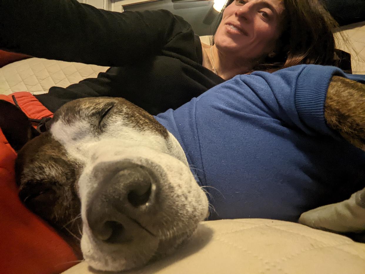 Van Gogh enjoys a nap alongside his adopter, Jessica Starowitz.  (Courtesy Jessica Starowitz)