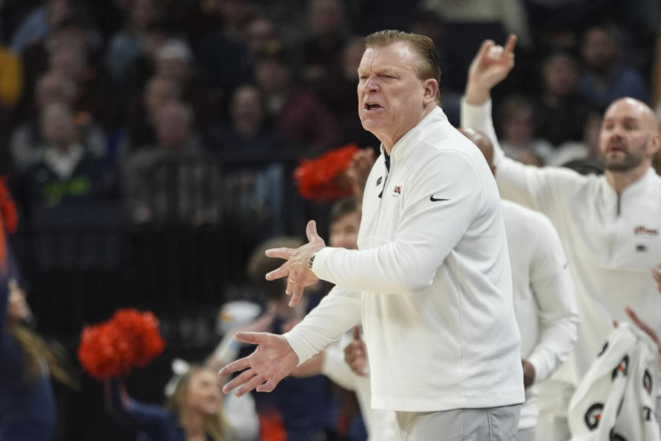 Illinois head coach Brad Underwood reacts during the first half of an NCAA college basketball game in the semifinal round against Nebraska of the Big Ten Conference tournament, Saturday, March 16, 2024, in Minneapolis. (AP Photo/Abbie Parr)
