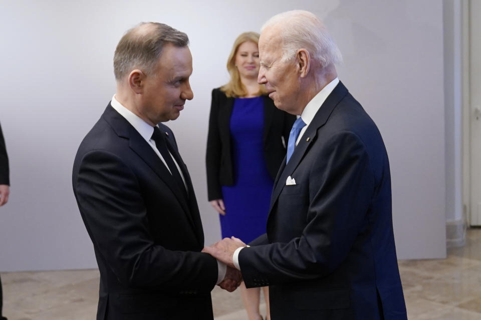 President Joe Biden, right, is greeted by Polish President Andrzej Duda, Wednesday, Feb. 22, 2023, at the Presidential Palace in Warsaw. (AP Photo/ Evan Vucci)