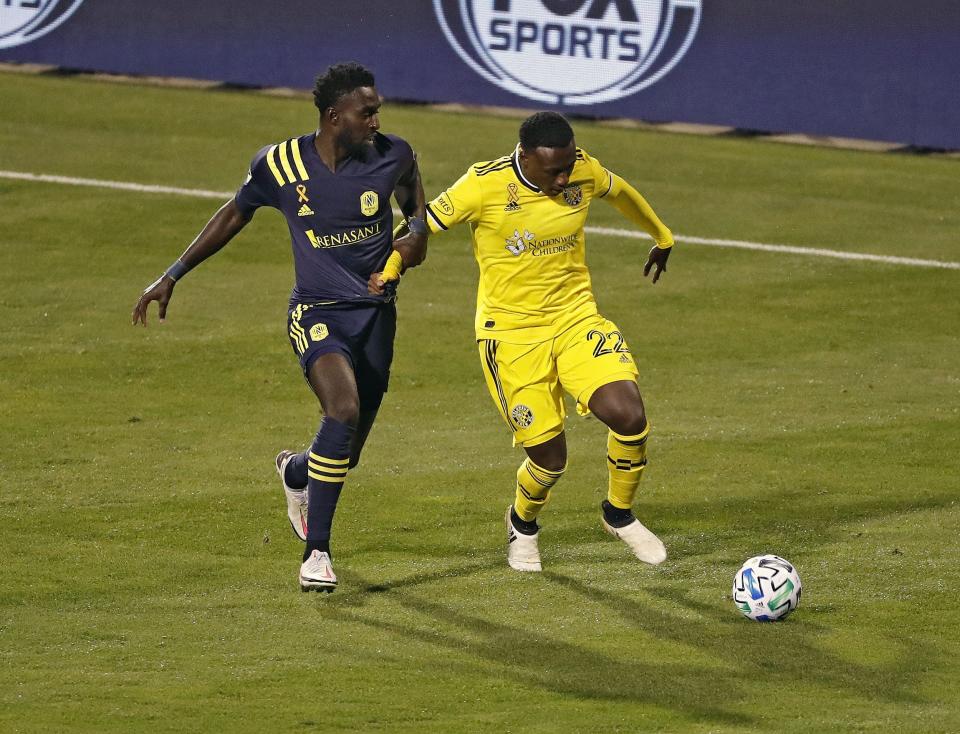 Derrick Jones Jr (left) goes up against Columbus Crew while a member of Nashville SC in 2020.