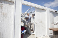 NEW YORK, NY - SEPTEMBER 8: Danny Fallon of Brooklyn, New York inspects the damage in his rental cabana where a tornado touched down on September 8, 2012 in the Breezy Point neighborhood of the Queens borough of New York City. The National Weather Service has issued a tornado watch as severe weather continues to move through New York metro area. (Photo by Ramin Talaie/Getty Images)